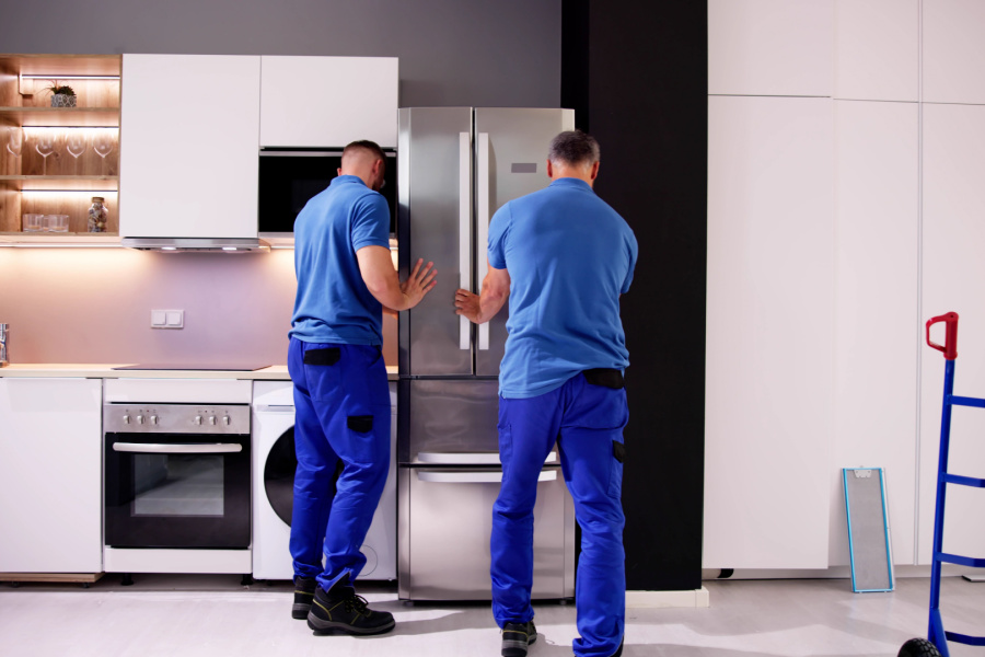 delivery crew installing fridge