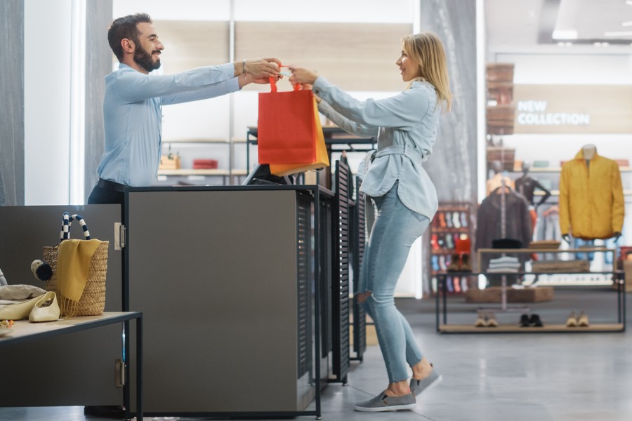 Woman making a purchase in a retail story