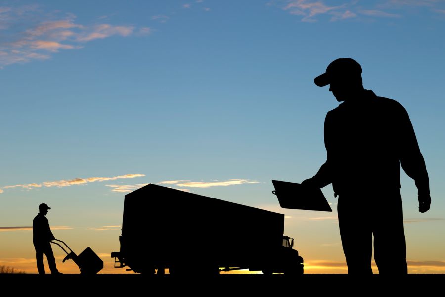 workers checking inventory before delivery