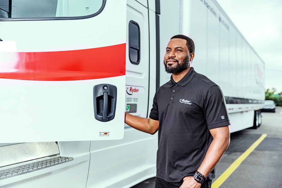 Ryder truck driver opening the door of his semi-truck